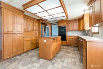 Large open kitchen with custom pantry cabinets