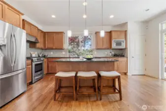 Open kitchen with slab granite top