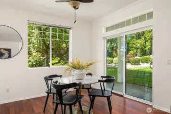 The dining room overlooks the common yard. The slider offers easy access to the patio.