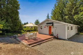 Entrance to the large mud room w/utility sink, storage, washer/dryer, and tile floors.