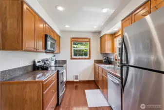 All appliances are included with this beautiful granite tile kitchen.