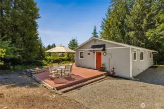Entrance to the large mud room w/utility sink, storage, washer/dryer, and tile floors.