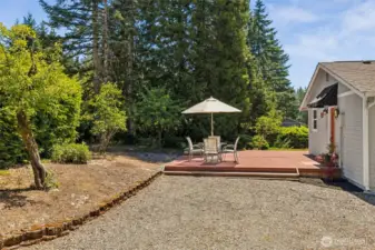 Private deck has room for a large patio set and additional seating around the fire pit.