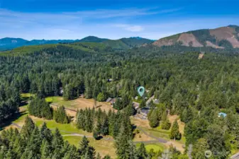 Aerial view with the Olympic Mountain foothills in the background.