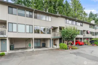 It's the one straight ahead with the visible 2nd floor deck just left of the tree.
