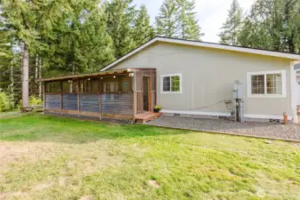 Side view of house & screened porch room.