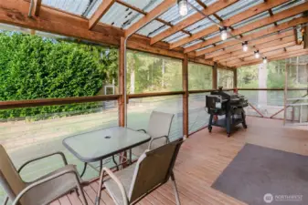 Covered, screened in porch area, perfect for rainy days