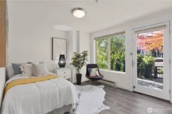Lower level bedroom leads to private patio.