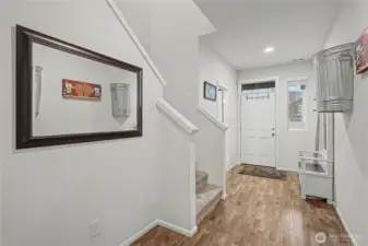 As you enter the home, you will find gorgeous flooring, and your first-floor powder room to your right.