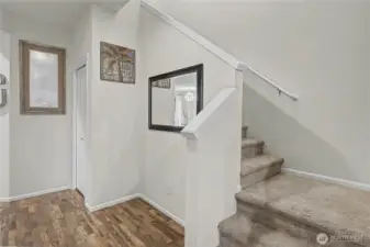 View of your stairway up, nice storage closet under the stairs as well.