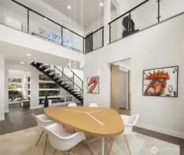 Soaring ceilings and a dramatic great room anchored by a sleek fireplace, opening seamlessly to the covered terrace beyond.