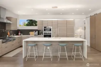 Chef’s kitchen with Poggenpohl cabinetry, Miele appliances, and a clean, architectural palette anchored by an oversized island.