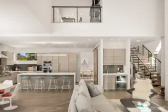 Expansive great room with effortless flow into the kitchen and entertaining spaces beyond.