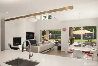 Kitchen positioned to engage the entire home—seamless sightlines to living, dining, and outdoor spaces.