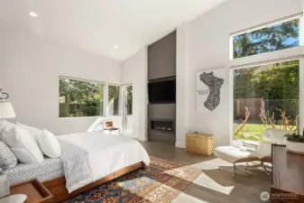 Primary suite with soaring ceilings, fireplace, and garden outlooks—private, quiet, and beautifully scaled.