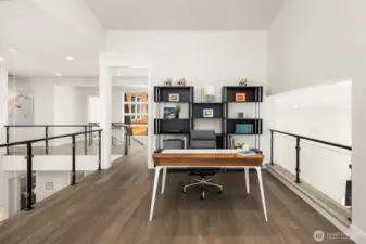 Open loft workspace overlooking the main living area—bright, connected, and highly functional.