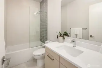 Well-appointed full bath with clean, modern finishes and tub/shower combination.