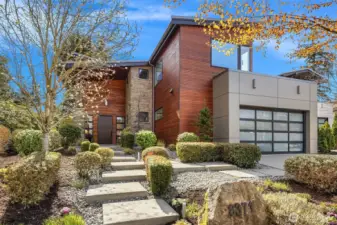 A cohesive exterior palette of wood, stone, and steel—timeless materials executed with precision.