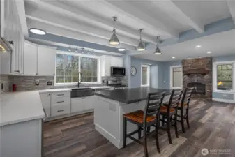 Thoughtfully designed kitchen offers abundant cabinetry, prep space, and casual dining.