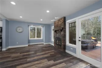 Living room opens to the deck for effortless indoor-outdoor enjoyment.