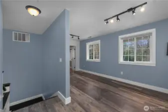 Spacious upstairs landing can easily serve as a media room, office, or hobby space.