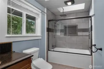 Stylish bath detail highlights the upgraded tile work and clean contemporary design.