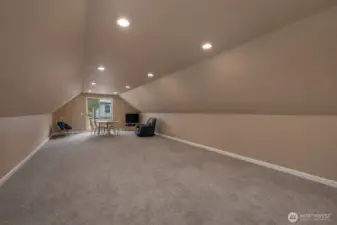 Finished upper-level garage space is ideal for hobbies, recreation, or a private retreat. This is a 'de staged' photo... We cleaned up the photo by removing personal items.