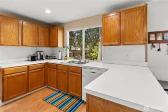 Pretty efficient kitchen with view to backyard.