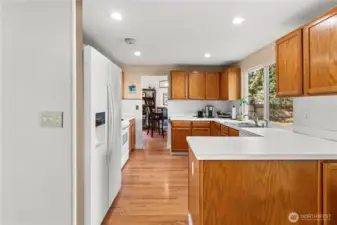 Straight shot from the kitchen eating area through the kitchen to the dining room.