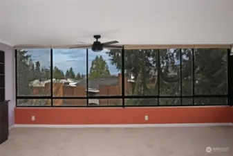 Big wall of windows with views of Space Needle and city skyline