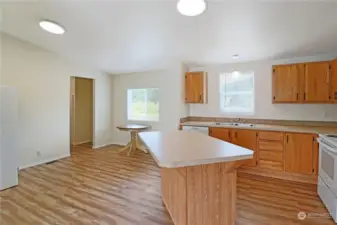 Dining area off the kitchen and access to the laundry room