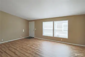 Large living room to accommodate your furnishings. All windows have blinds