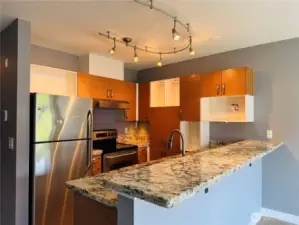 Kitchen with stainless steel appliances, granite countertop