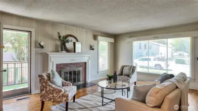 Cozy Wood Fireplace W/ Plenty Of Natural Light And Entry Door From The Side Of The Home
