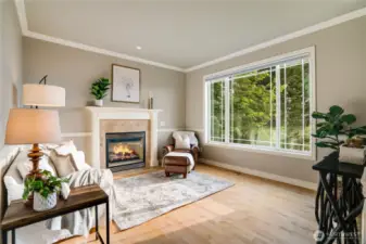 Living room is a great place to enjoy the views in repose.  Grab a book, turn on the fireplace & enjoy.  Home faces west for an abundance of natural light, so welcome during the gray season.