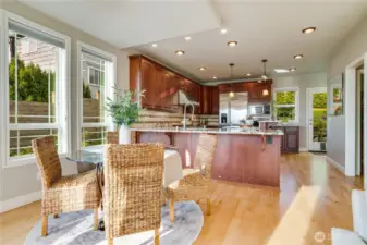 Large kitchen also has access to rear yard & patio thru showroom door in rear of photo.  Wine bar thru door way to right opens to walk in pantry.