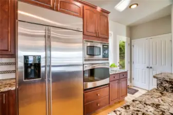 True counter depth refrigerator, wall oven is second oven & microwave.