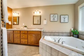 Primary bathroom with large jetted tub for the spa experience.