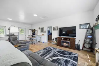 Spacious and sunny with a door leading onto the backyard.