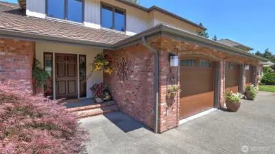 This classic brick exterior opens to a warm, welcoming entryway. Lovingly maintained inside and out.