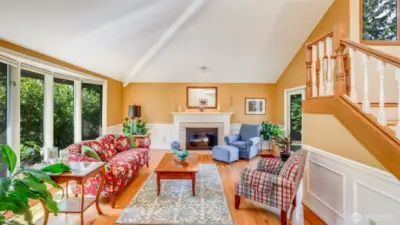 This formal living room with a gas fireplace provides an inviting space for entertaining.
