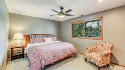 Guestroom #1. All 3 guest rooms are upstairs and have ceiling fans, fit large bed sets.