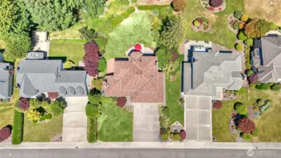 Enjoy this spacious extended driveway leading to a 3 car garage ensuring plenty of parking. Level shy half acre property.