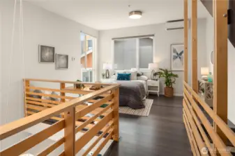 The airy primary suite offers a serene retreat with oversized windows, modern finishes, and an open loft-like design that fills the space with natural light.