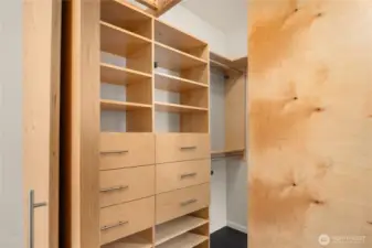 Massive walk-in closet with shelving system.