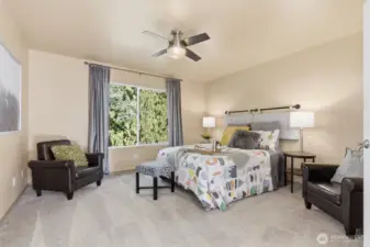 Beautiful primary suite overlooking your serene outdoor oasis.