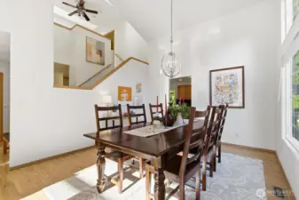 Light filled, formal dining room with grand vaulted ceilings.