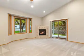 Curl up on a chilly winter eve in front of this toasty warm gas fireplace. Slider goes out to covered wrap around porch area for year around outdoor living.