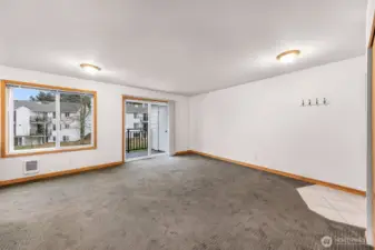 Living space and dining area and balcony access view