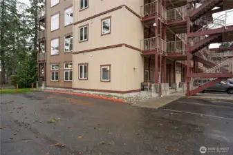 Ground floor, end unit, plenty of higher windows all with blinds.